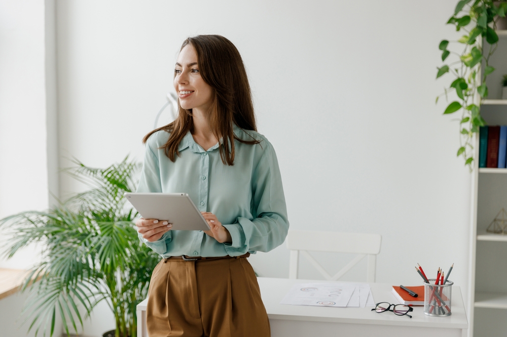 woman beside window panel